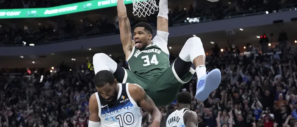 Giannis-Antetokounmpo-34-dunks-the-ball-against-Minnesota-Timberwolves-guard-Mike-Conley-10